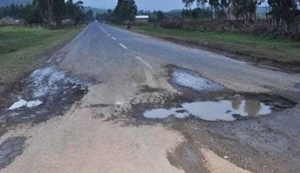 If you see a pothole in the road, immediately take out your mobile phone and take a picture...