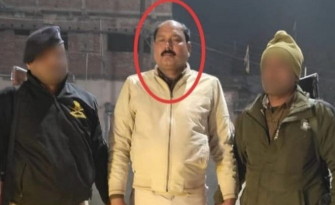 right at the police station gate...