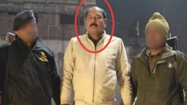 right at the police station gate...