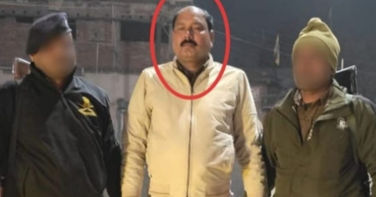 right at the police station gate...