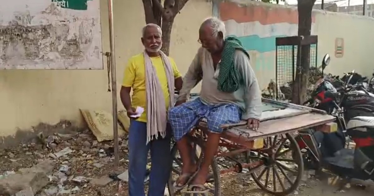 Elderly voters arrived to vote on a cart