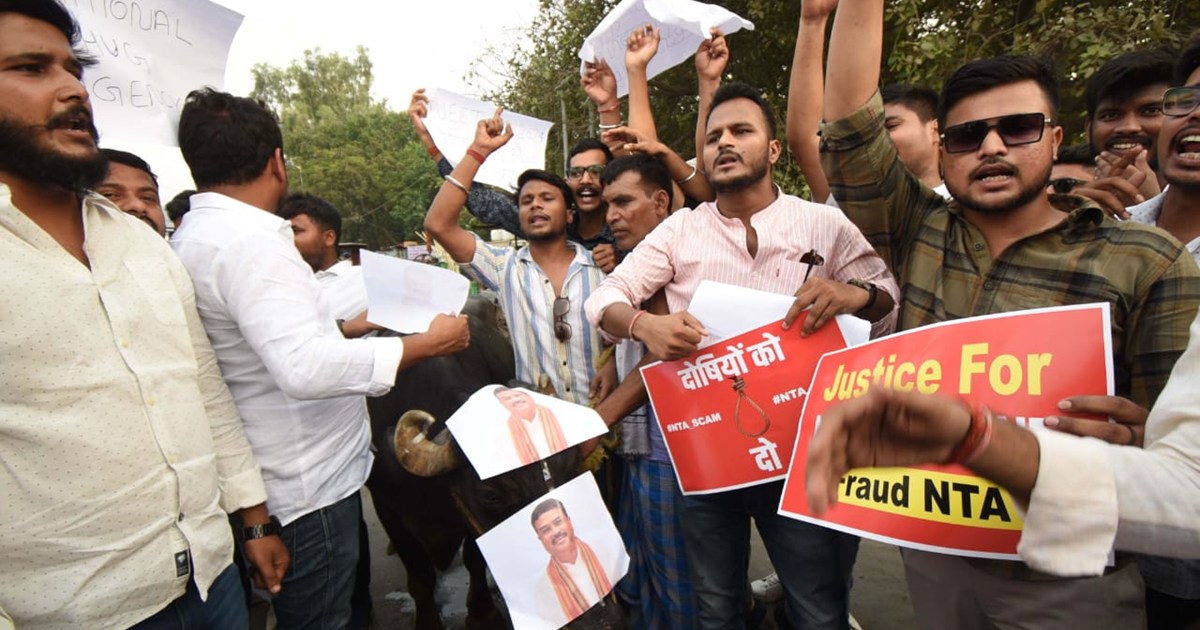 Students protest with buffalo and donkey regarding NEET exam