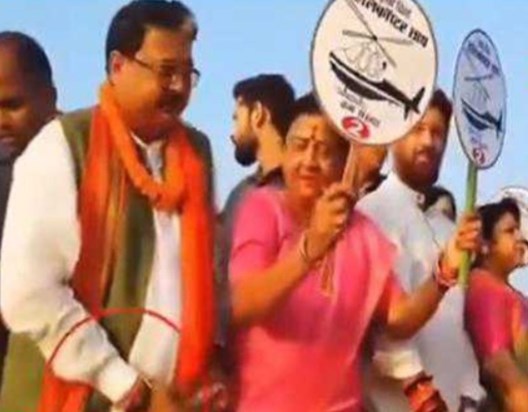 Case filed against BJP MLA for distributing money during roa Case filed against BJP MLA for distributing money during roa