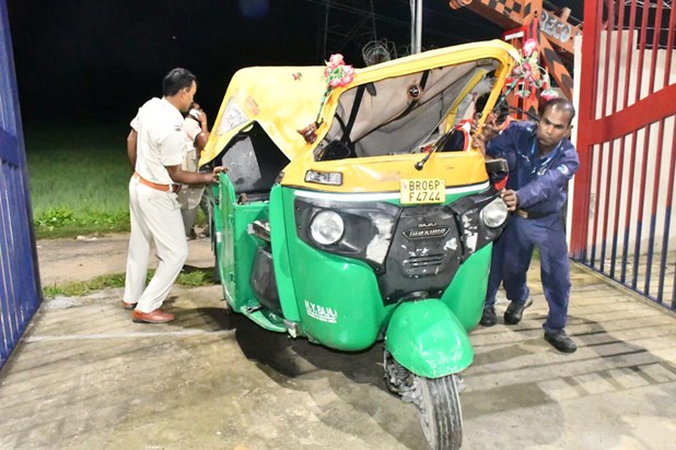 An auto rickshaw full of women and children going to see a f An auto rickshaw full of women and children going to see a f