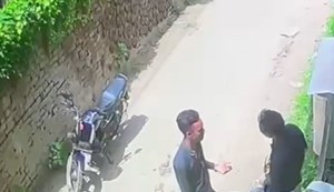 A miscreant shot a young man in front of the police station