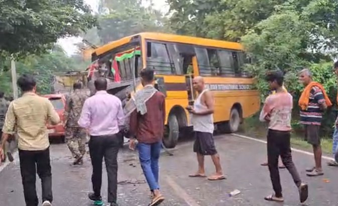 A bus carrying school children collided with a truck. A bus carrying school children collided with a truck.