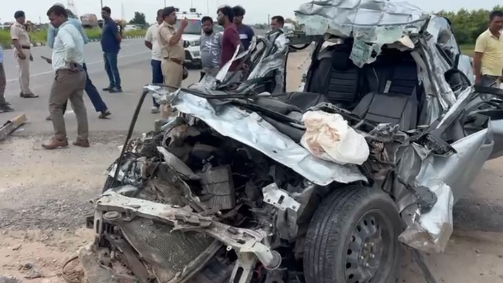 A car rammed into the back of a moving truck