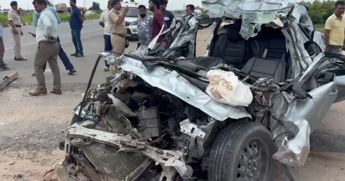 A car rammed into the back of a moving truck